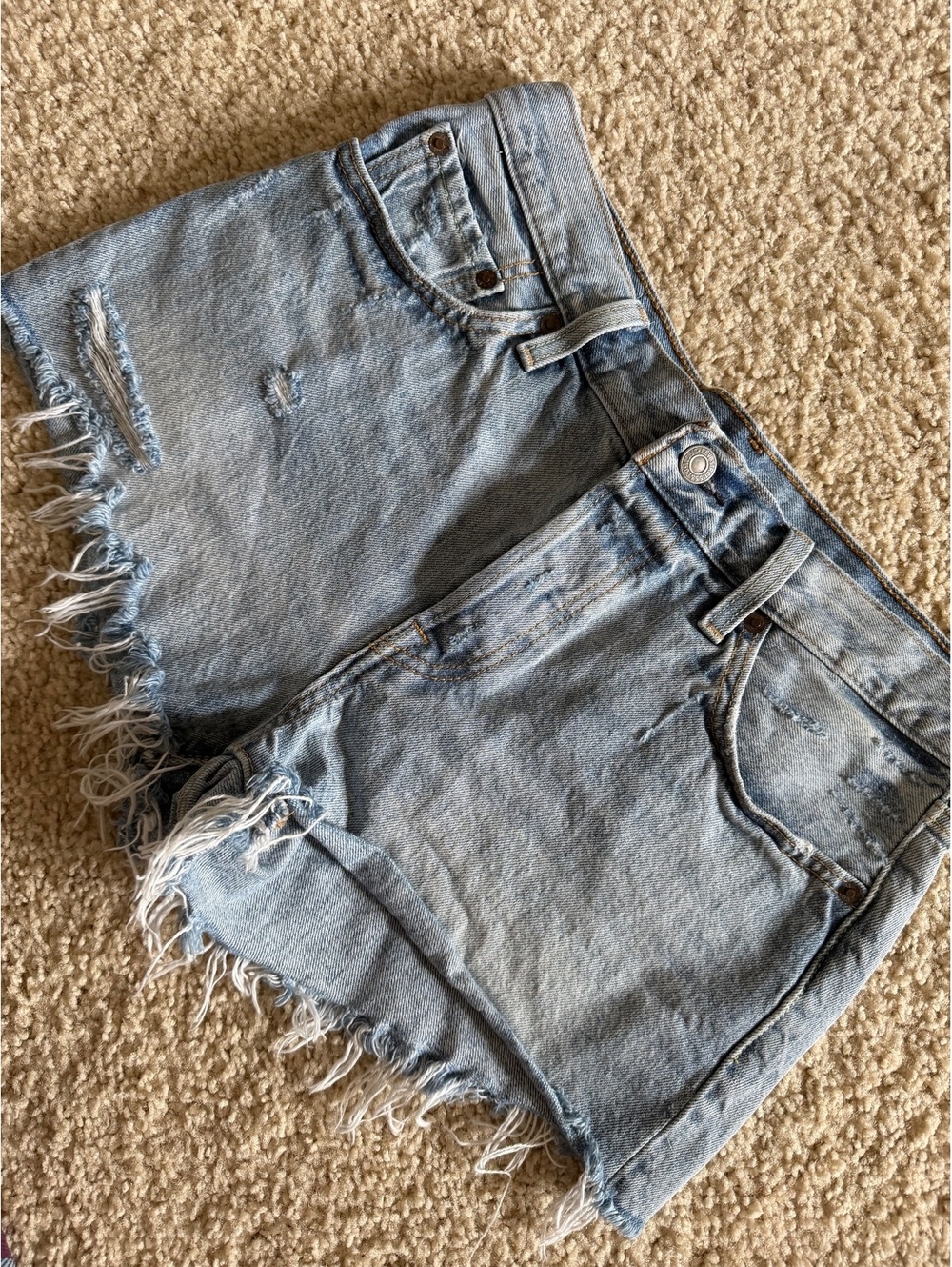 27/28 Levi’s 501s, lighter wash, raw hem